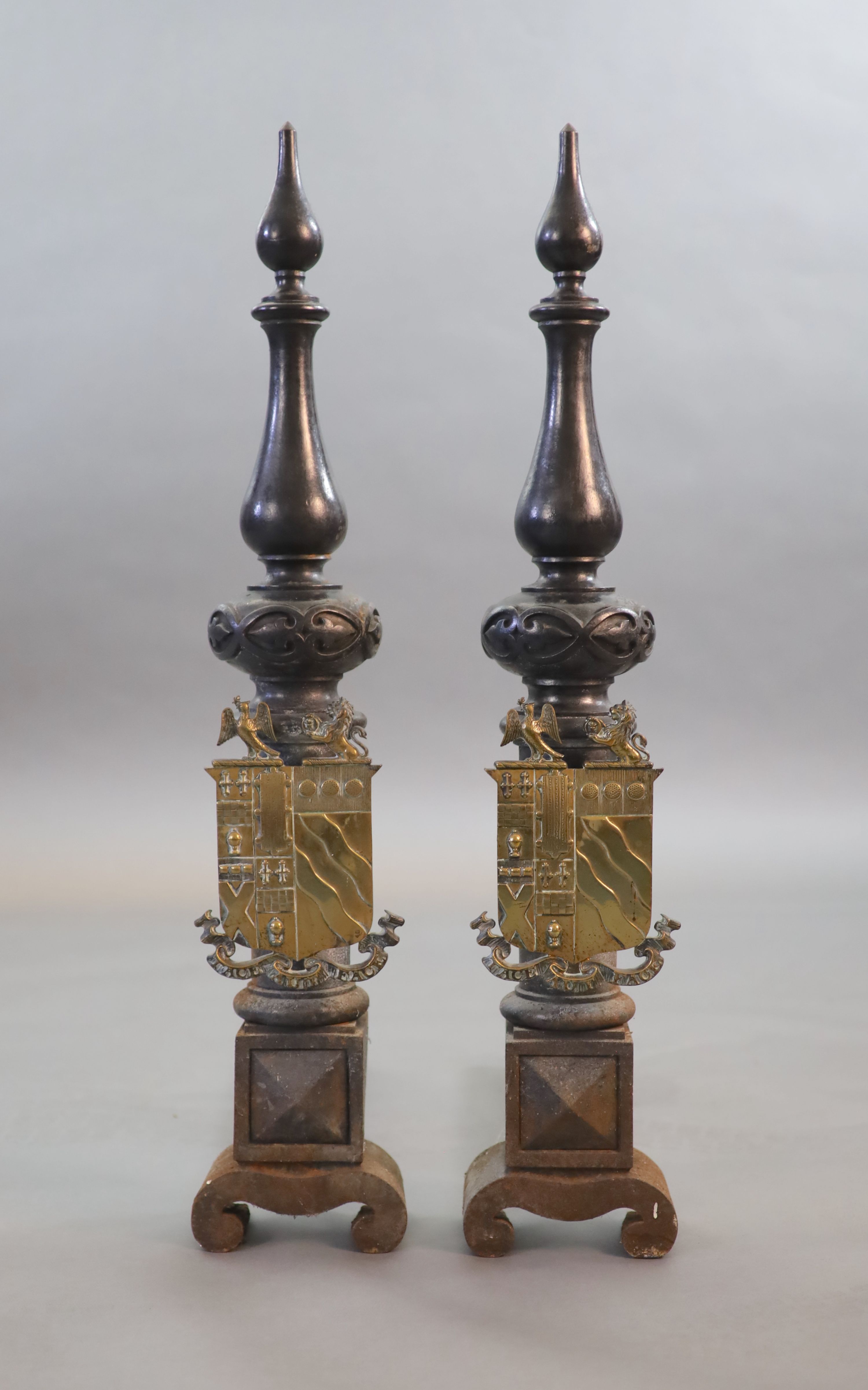A substantial pair of 19th century heraldic cast iron fire dogs, 55cm deep, 81cm high